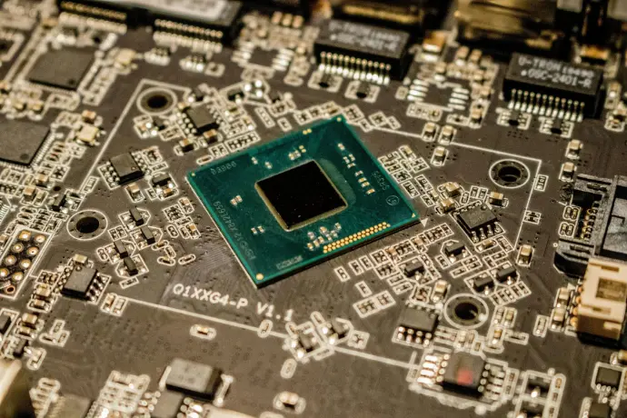 Black electronic motherboard with PCIe slots and components